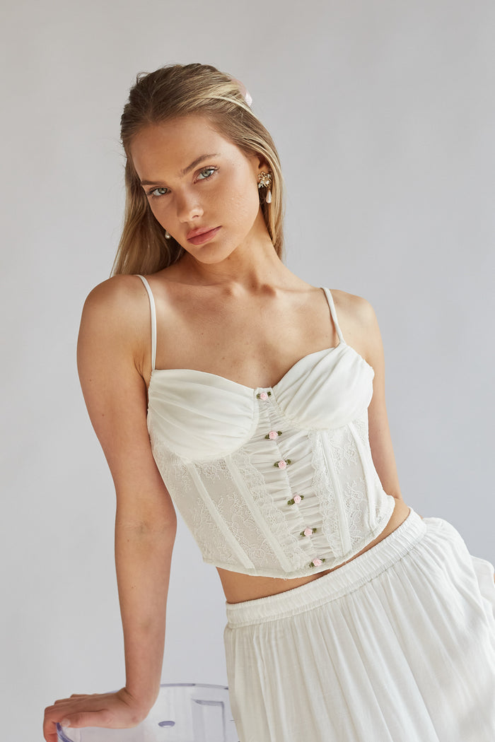 white boned mesh corset with bustier cups and pink rosette buttons | soft girl aesthetic corset top with satin mini roses