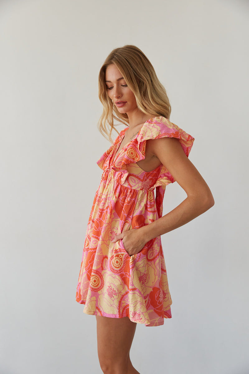 side view | orange floral flutter sleeve babydoll mini dress | summer dress inspo 