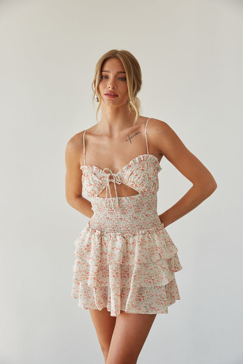 pink floral romper with keyhole cutout, smocked waist, and tiered ruffle skirt | unique summer outfits 2024