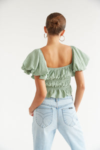 sage green ruffled crop top with puff sleeves