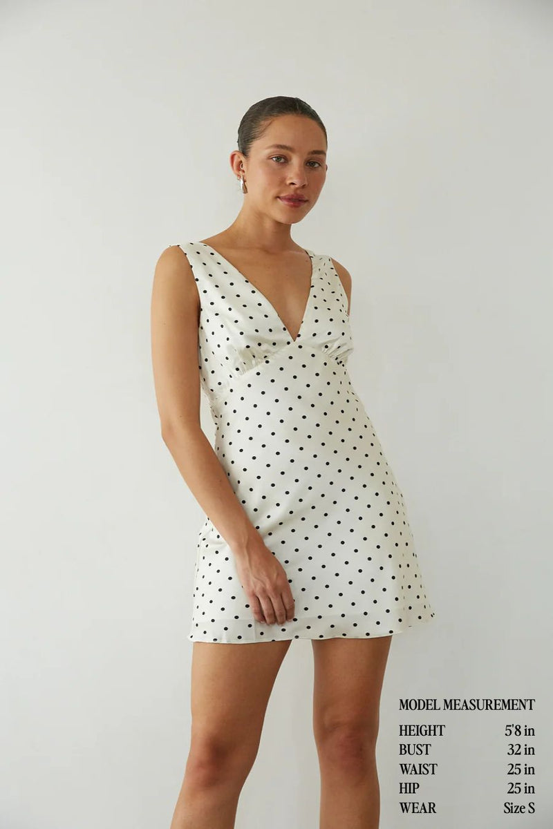 front view | v neck white and black polka dot mini dress