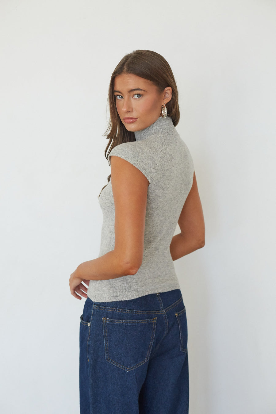 Heather grey turtleneck knit crop top, back view on model