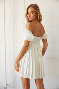 white flowy mini dress with puff sleeves- perfect for a day date