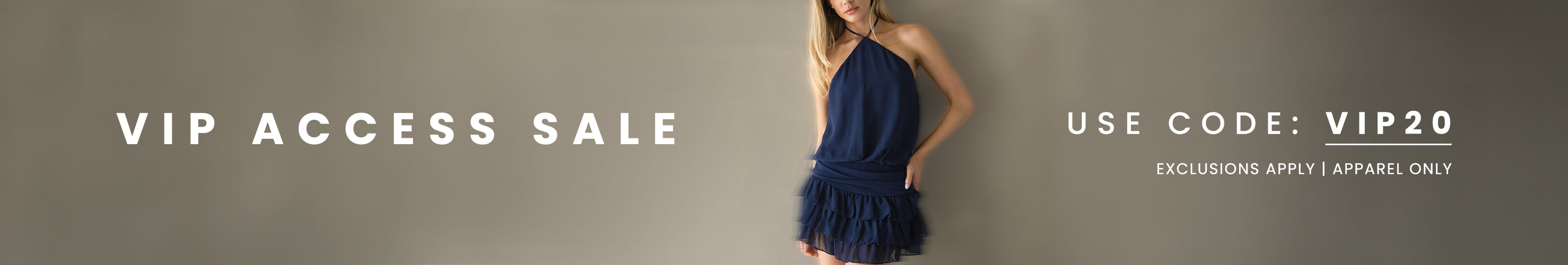 Woman in a navy dress against a gray background with VIP access sale text and code.