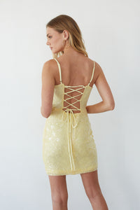 back-image | Yellow lace dress with criss-cross back design on a plain background