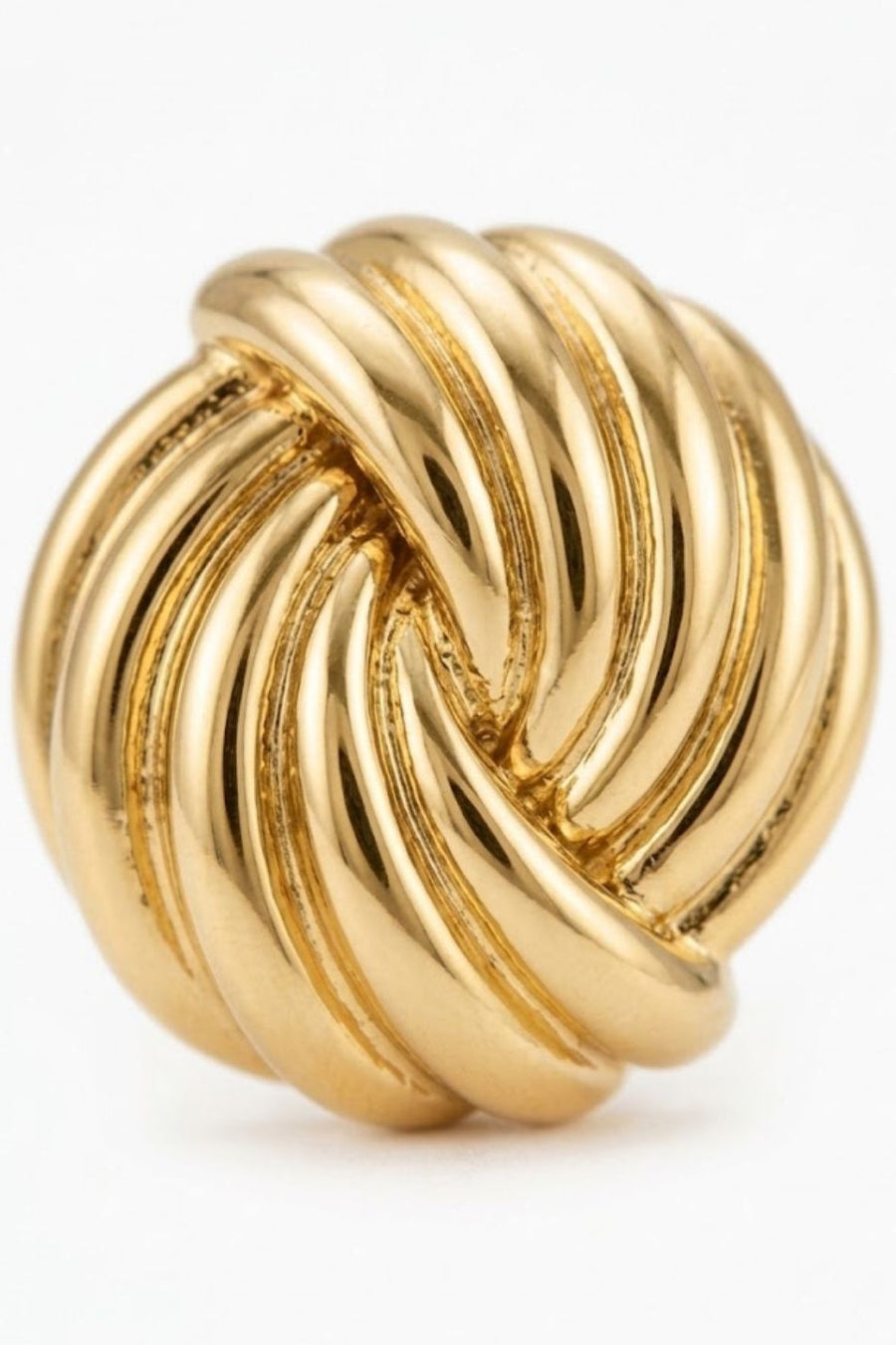 A polished gold knot-shaped ring with a highly reflective finish, photographed on a clean white background.