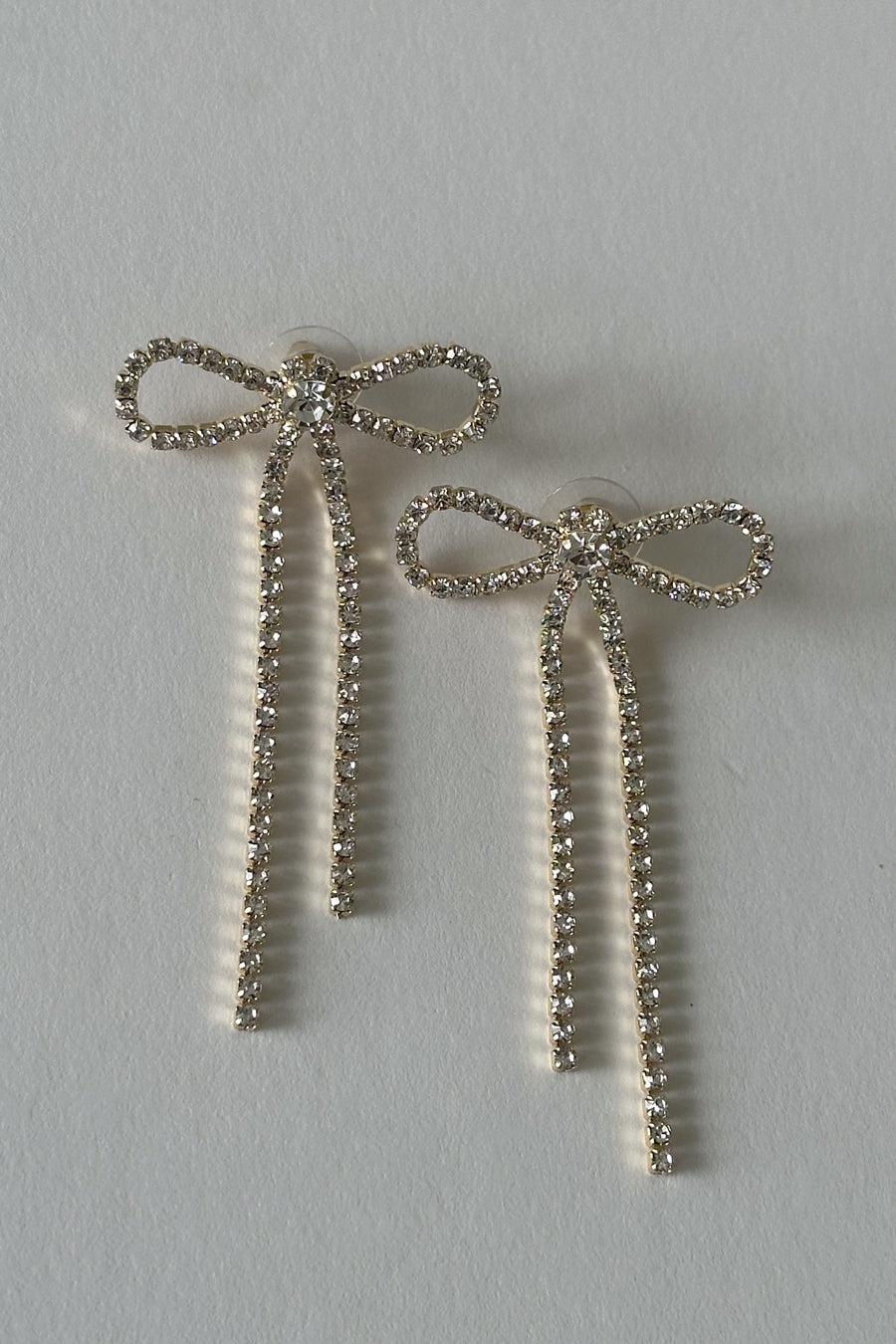 Front view | Gold Rhinestone Bow drop studs | daytime event drop suds