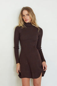 brown-image | Woman wearing a brown dress against a white background