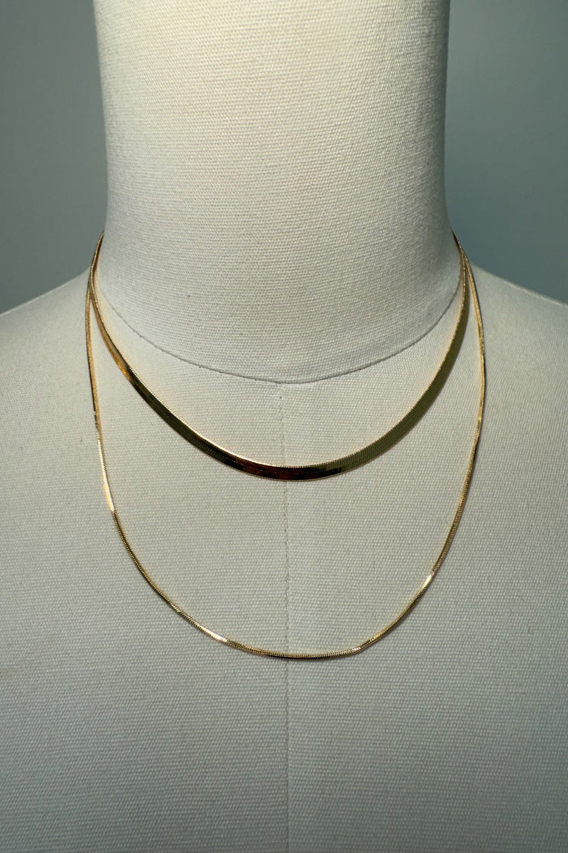 gold-image | front-image | gold layered necklace | sleek design | front view of a gold layered necklace with two delicate chains
