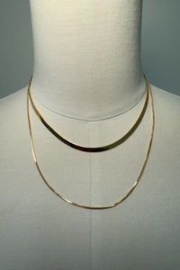 gold-image | front-image | gold layered necklace | sleek design | front view of a gold layered necklace with two delicate chains