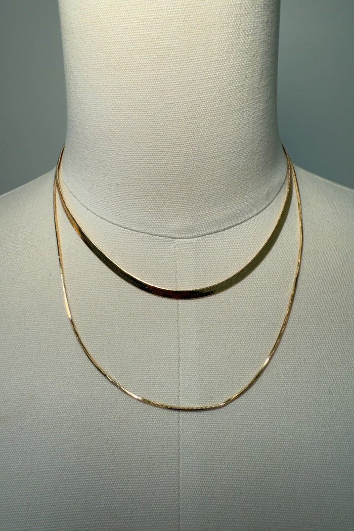 gold-image | front-image | gold layered necklace | sleek design | front view of a gold layered necklace with two delicate chains
