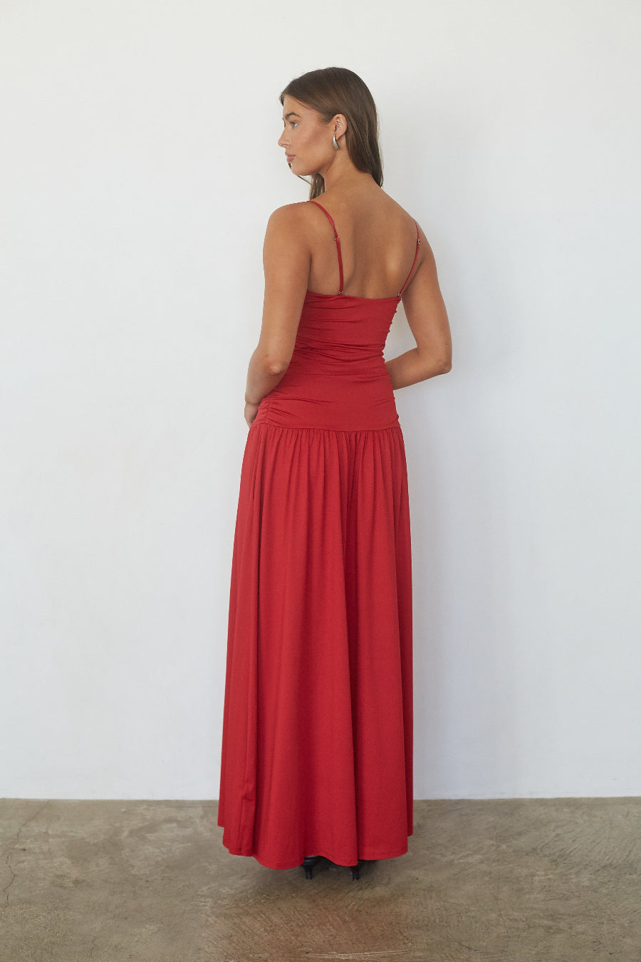 Red twist front drop waist maxi dress, back view on model