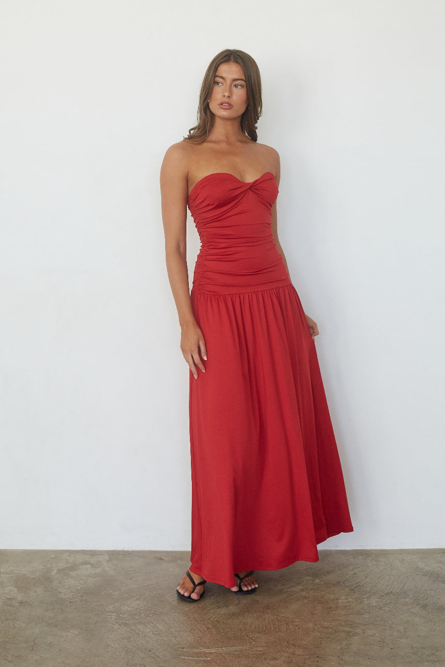 Red twist front drop waist maxi dress, strapless style with straps removed, front view