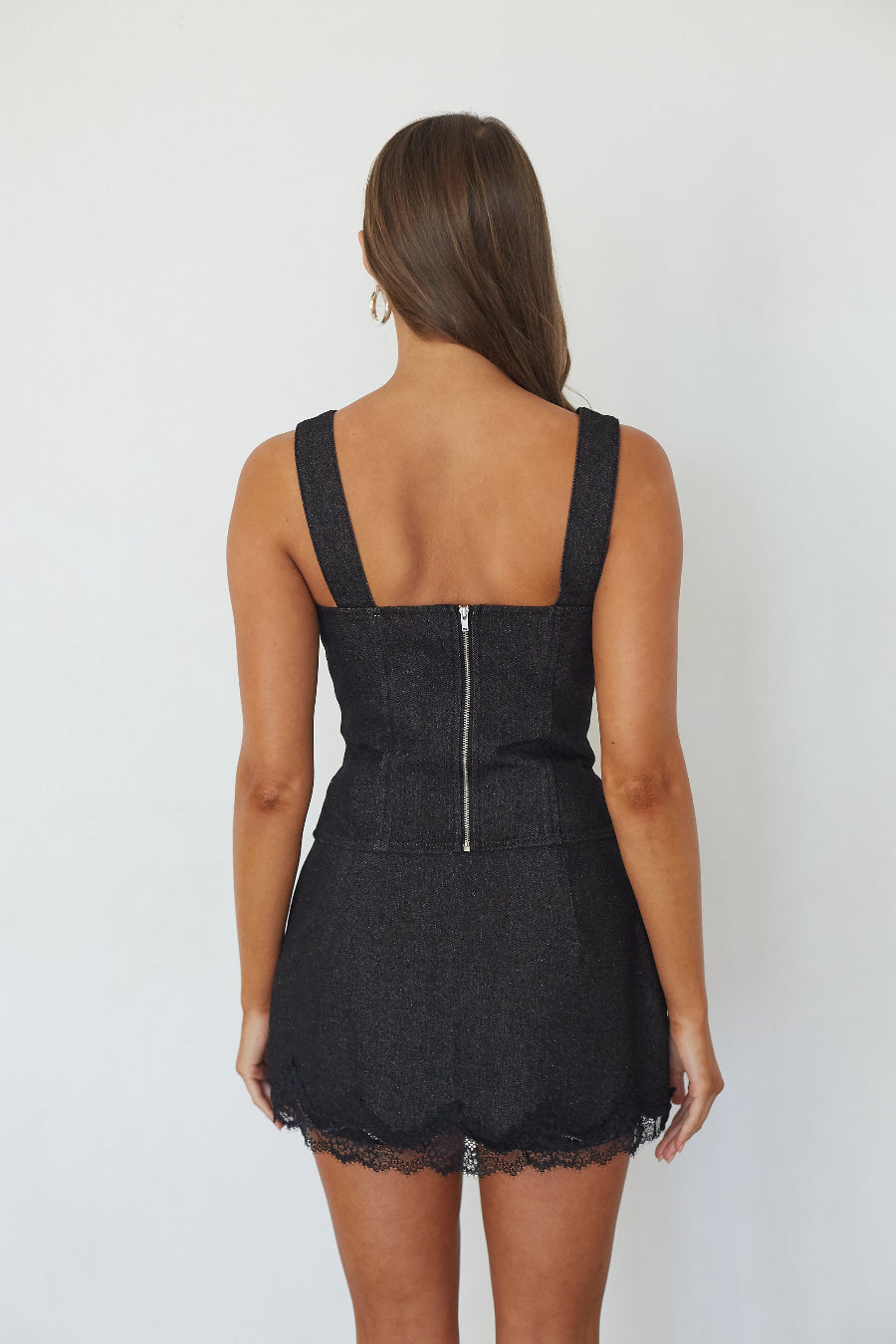 Black denim lace trim bustier top, back view showing zip closure