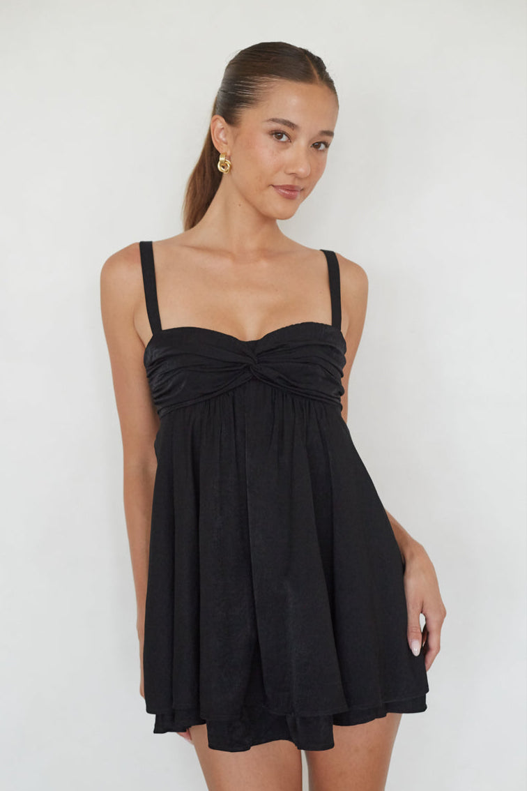 black-image | Woman wearing a black dress against a white background