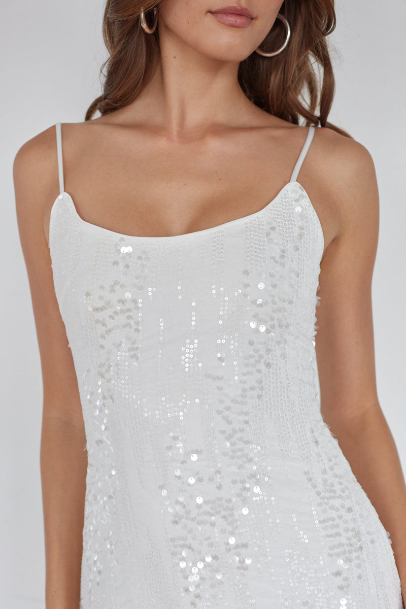 White sequin dress on a plain background
