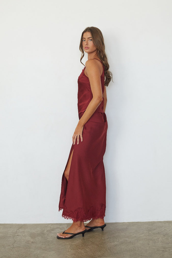 red-image | Red satin lace trim maxi skirt with side slit, side view on model
