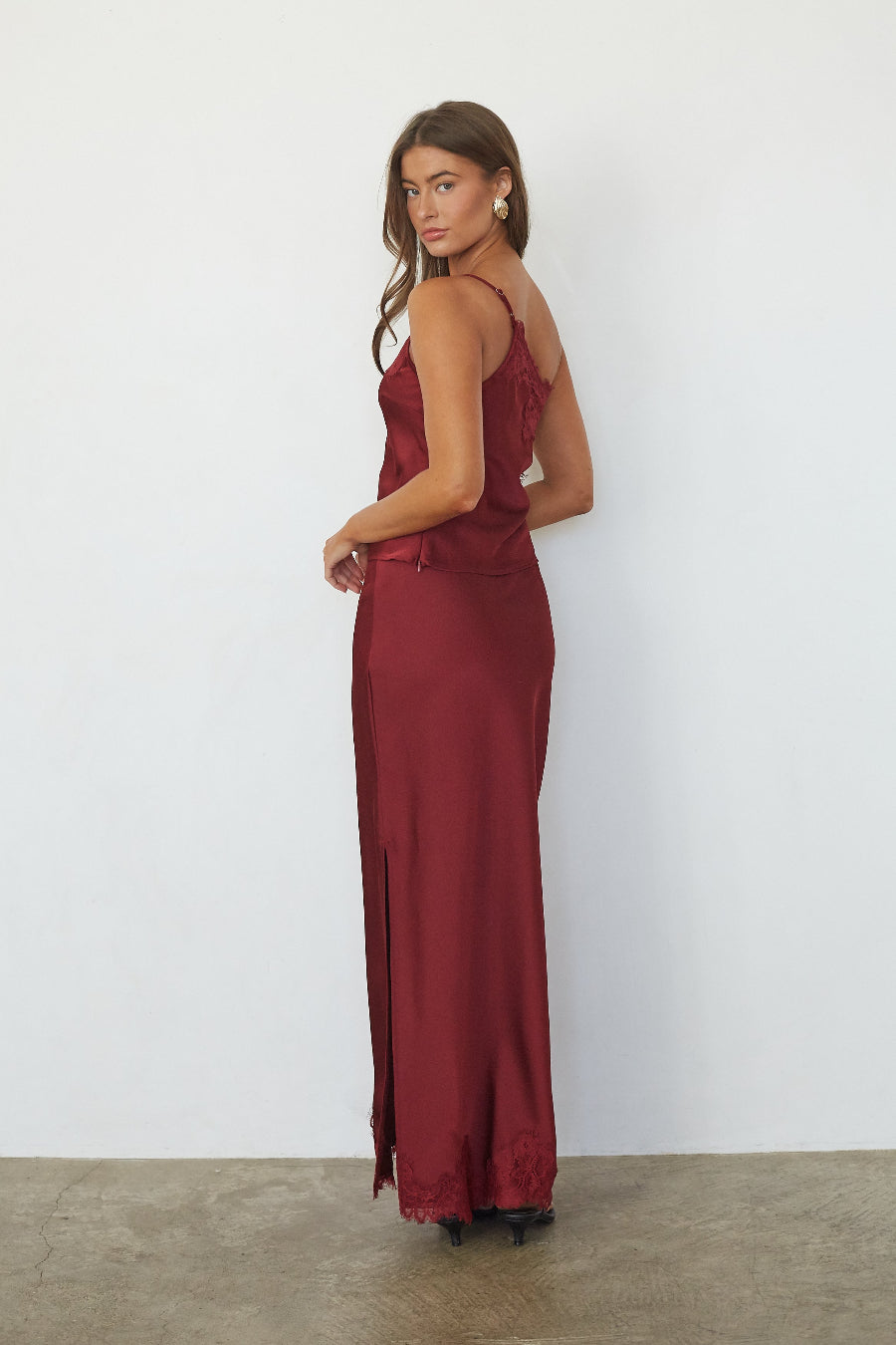 Red satin lace trim maxi skirt, back view on model