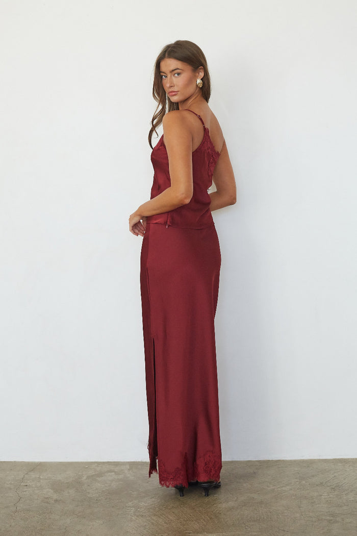 Red satin lace trim maxi skirt, back view on model