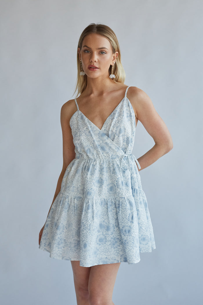 Whitney Floral Wrap Mini Dress Shop American Threads Women's Trendy Online Boutique White/Blue Floral / L Whitney Floral Wrap Mini Dress Shop American Threads Women's Trendy Online Boutique White/Blue Floral / L