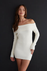 white-image | Woman wearing a white off-shoulder ribbed dress against a black background