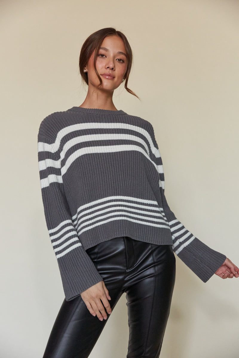 grey and white striped sweater with flare sleeves and tight knit - winter wardrobe essentials