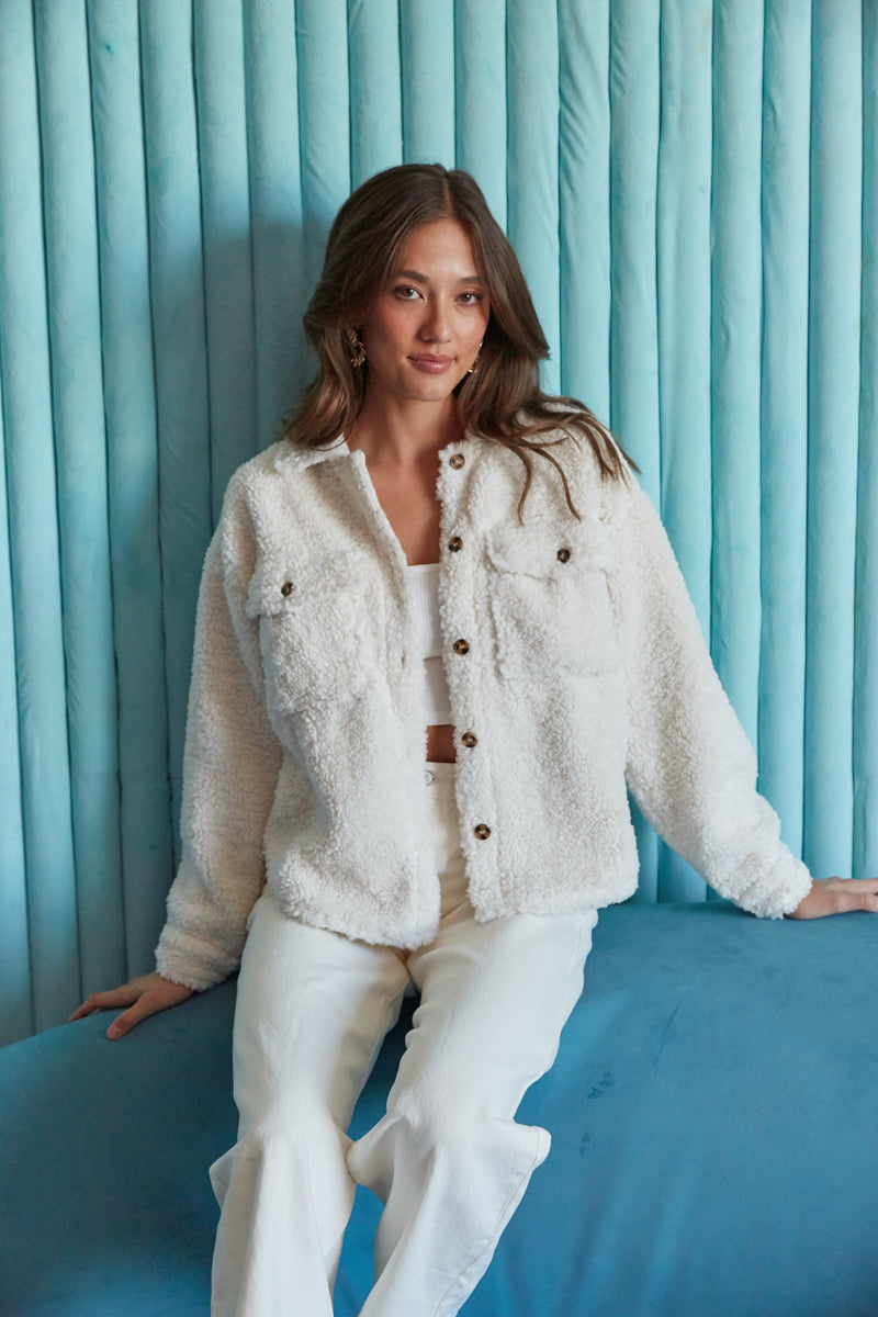 fresh white plush and soft sherpa jacket with buttons and pockets | what to wear for college
