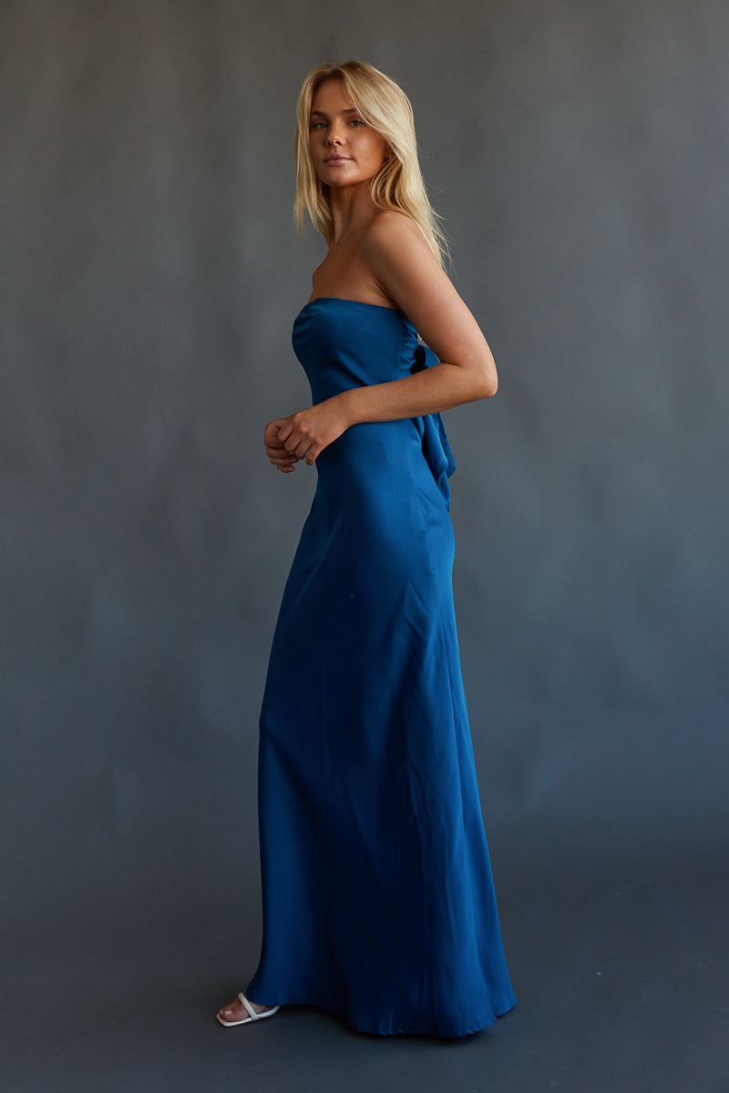 teal blue strapless gown with bow tie at back 