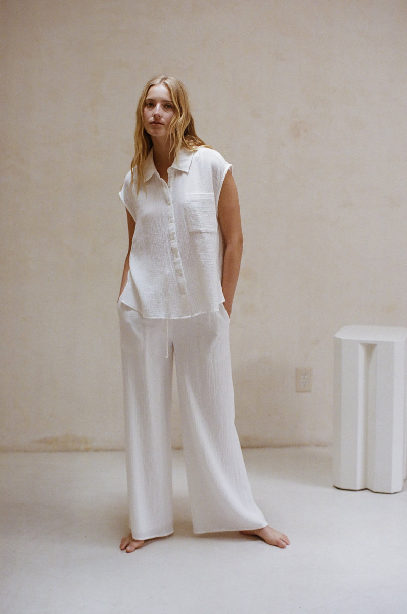 white matching cotton outfit inspo - wide leg drawstring pants  - sleeveless collared shirt - white matching resort outfit