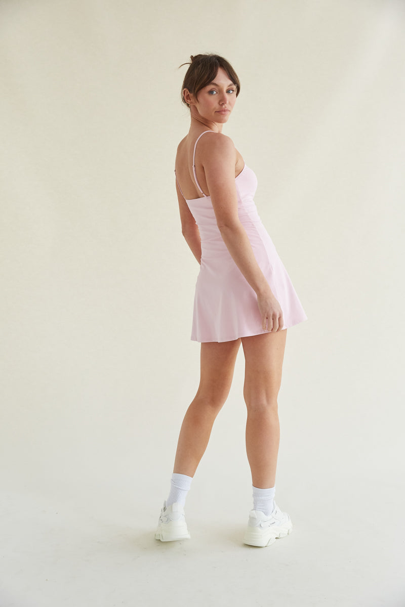 baby pink tennis skort dress with adjustable straps and buttersoft fabric 
