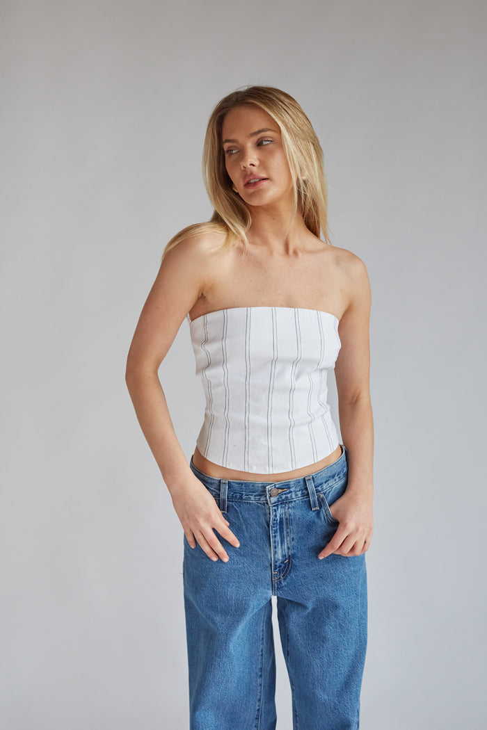 white strapless corset top with black vertical stitch stripes | game day outfit inspo 