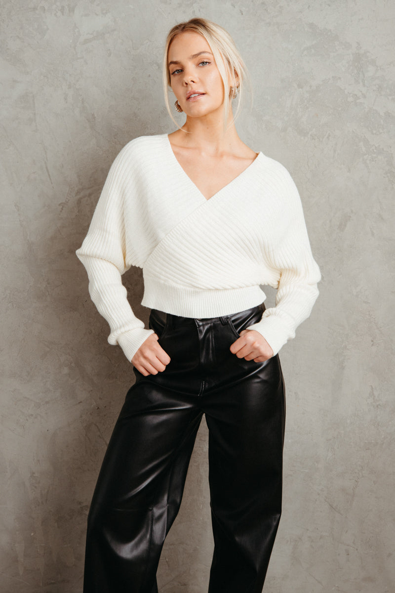 white criss cross open back sweater - white sweater outfit for fall - faux leather pants