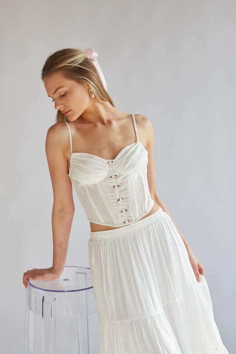 white corset top with lace detailing and pink mini satin roses | balletcore corset top with sweetheart neckline