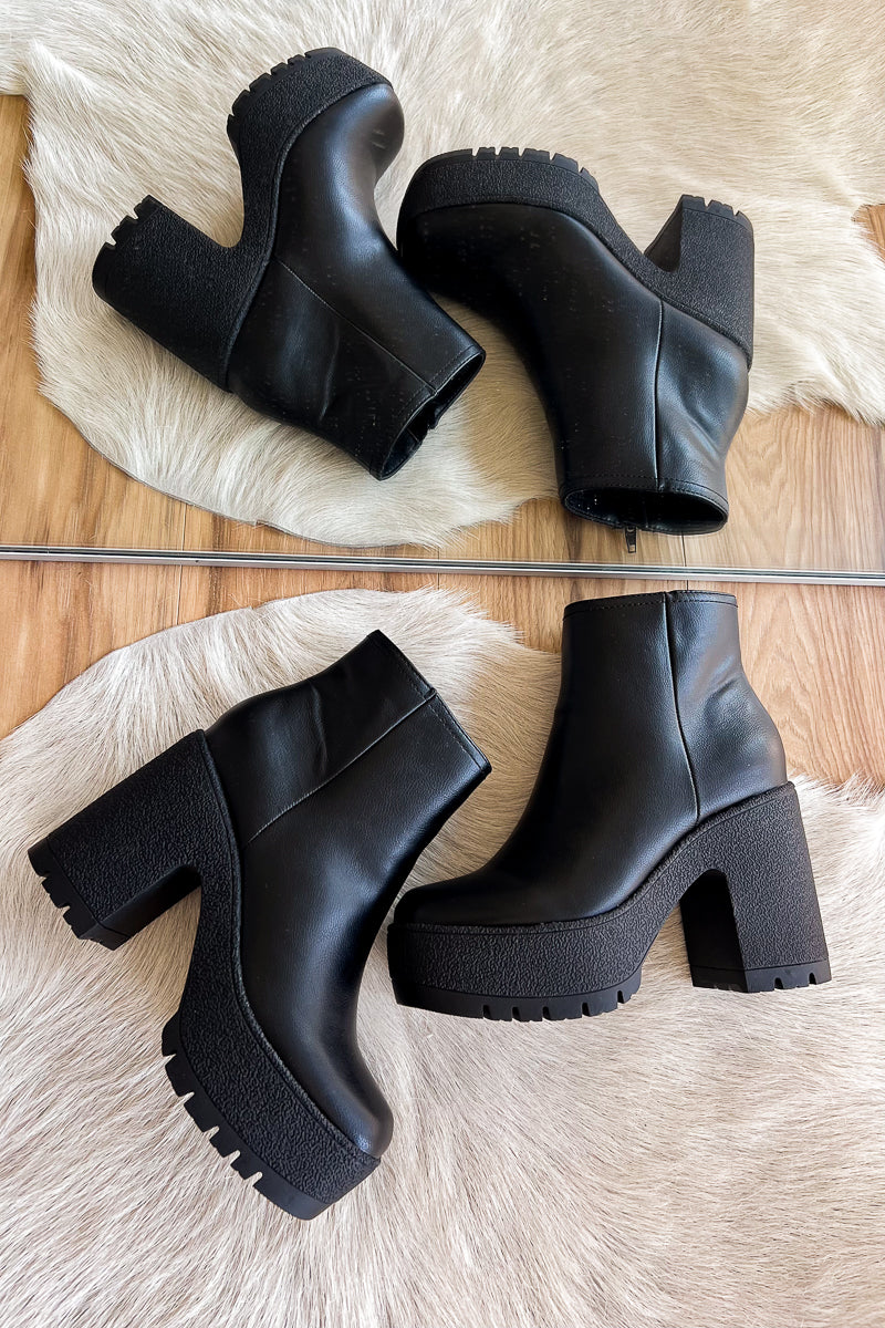 trendy black booties with lug sole and platform heels