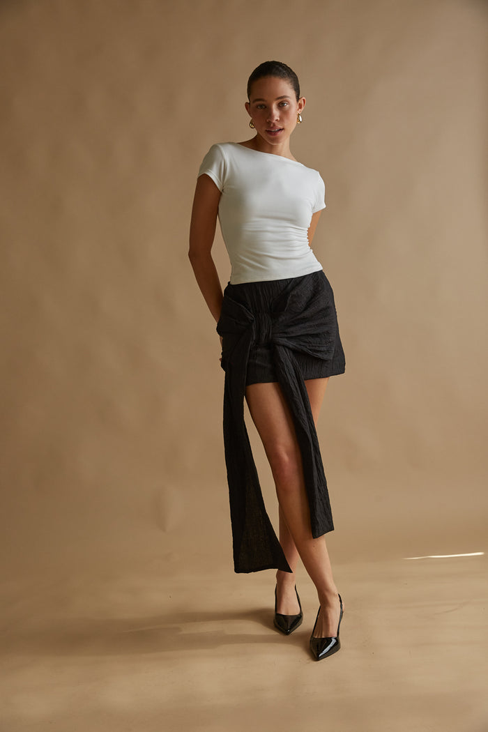 black bow front mini skirt with side drape