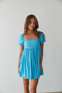 flowy and airy babydoll dress with puff sleeves in bright blue