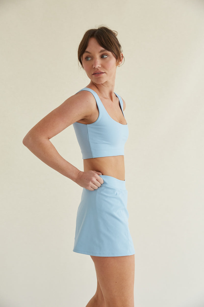 Fitted baby blue tennis skort with side slit and built-in shorts 