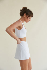 white mini skort with side slit and butter-soft fabric