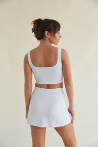Straight cut white skort with side slit and built-in shorts 
