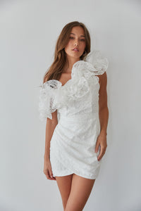 White lace embellished mini dress with asymmetrical ruffle shoulder detailing 