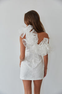 white asymmetrical mini dress with statement ruffle design