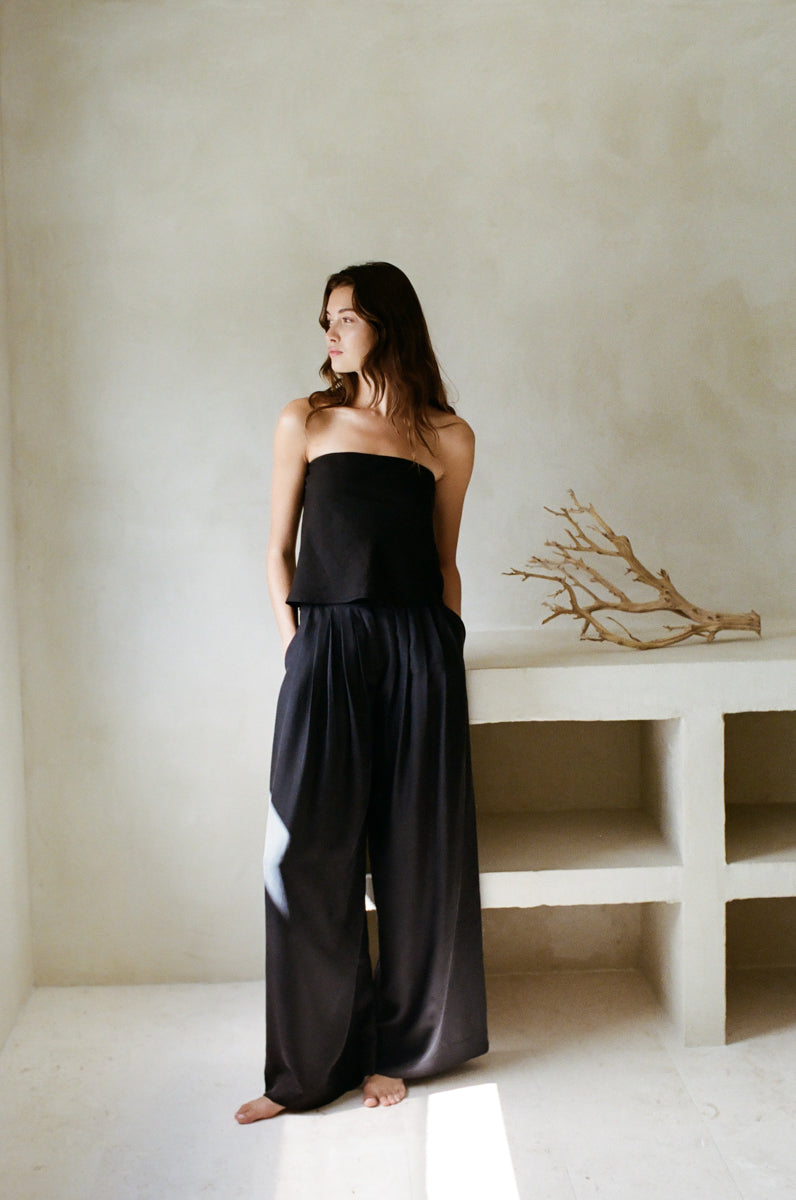 black linen strapless top and drawstring pants - relaxed vacation outfit - breezy resort set