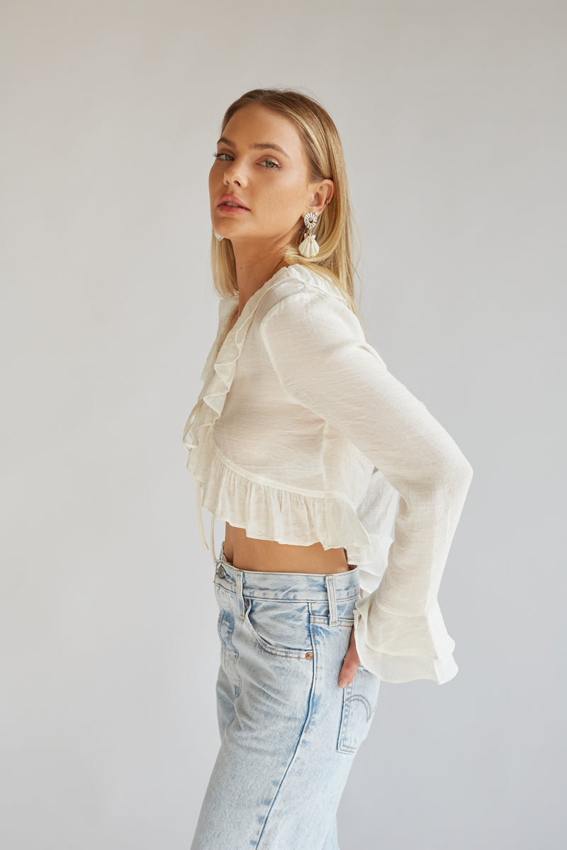 ruffle long sleeve white top with tie front detail | elevated white ruffle tops for spring