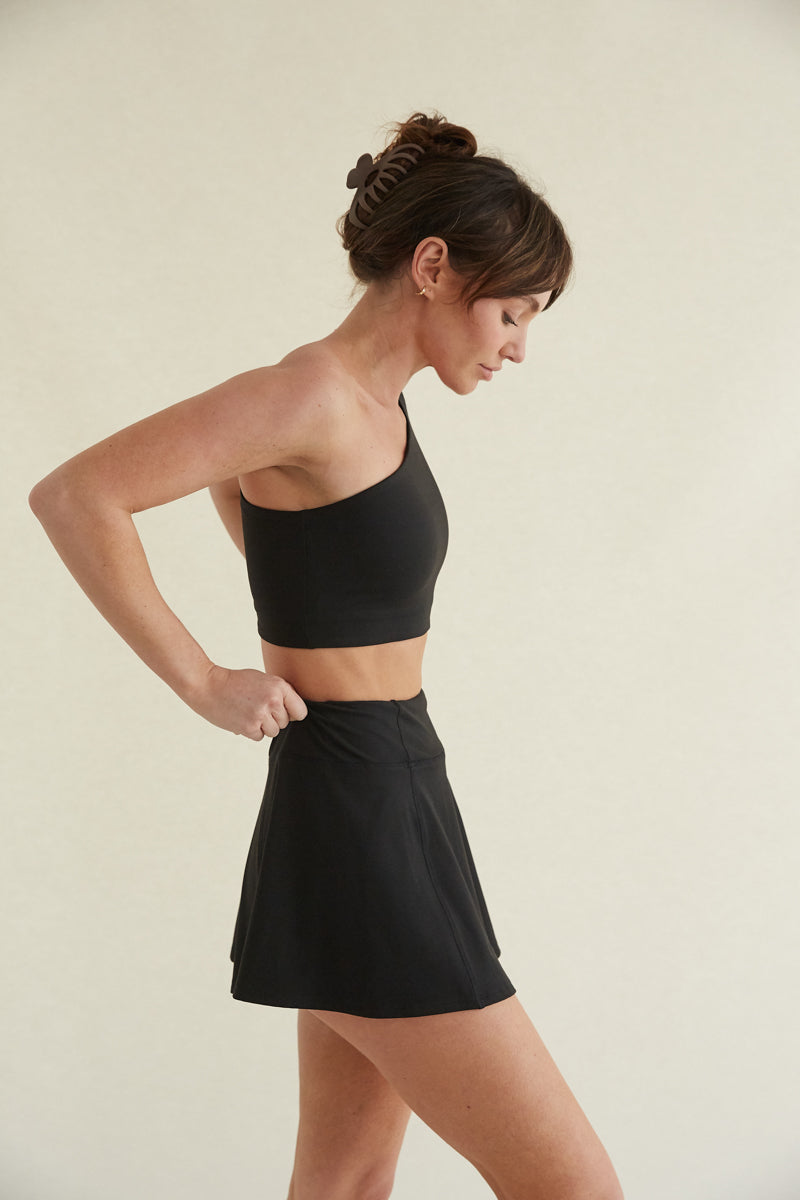 black high-waisted flare mini tennis skort with built in shorts and butter-smooth fabric