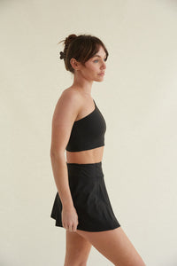 black flattering high-waisted flare mini tennis skort with built in shorts