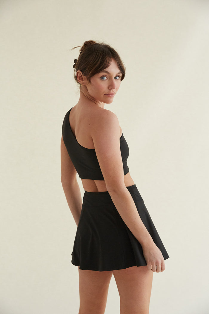 black high-waisted flare mini tennis skort with built in shorts