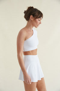 White high-waisted fit and flare tennis skort with built in shorts and butter-smooth fabric