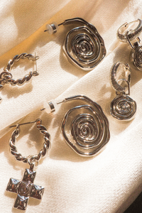 silver twisted hoop earrings with cross charm by luv aj