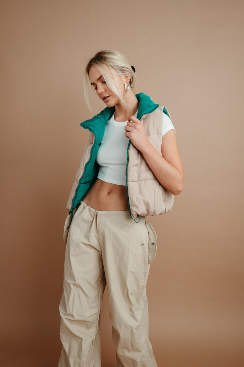 beige and emerald green reversible puffer vest for winter | winter layering must haves 
