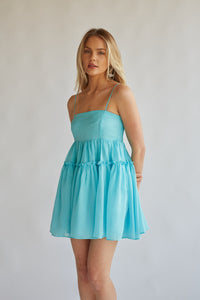 front view straight across neckline aqua blue spaghetti strap babydoll dress perfect for homecoming, rush, beach vacations, and more